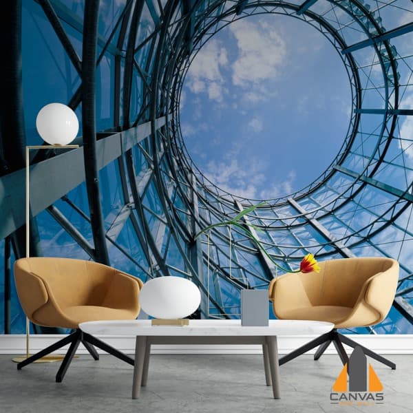 Looking up at a modern, circular glass and steel structure in a wall mural in a modern living room.