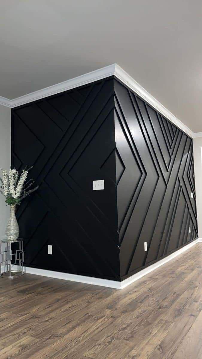 Bold geometric accent wall with black paneling, perfect for wallpaper installations in Gauteng.