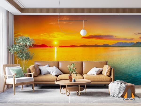 Vivid sunset ocean wall mural in a modern living room with brown sofa and light wood furniture