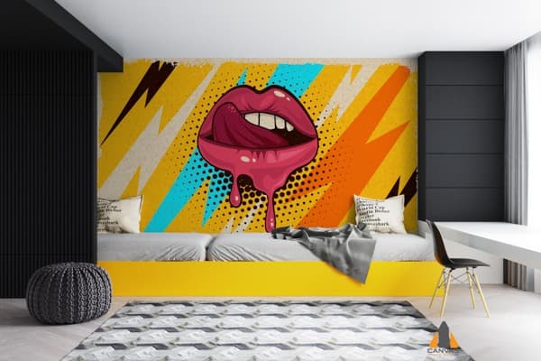Pop art pink lips wall mural with a dripping tongue, in a modern bedroom with a yellow bed frame.