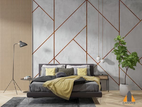 Geometric concrete custom wallpaper in a modern bedroom with a dark bed and green plant.
