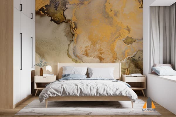 Gold and grey abstract fluid art wall mural in a modern bedroom, available for wallpaper installations in Gauteng.