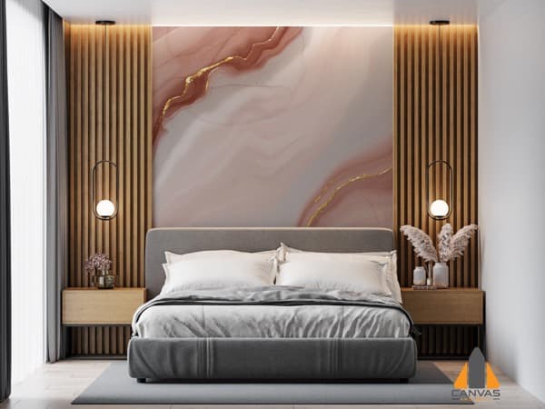 Pink and gold marble wall mural installation in a modern bedroom, with wooden slats.