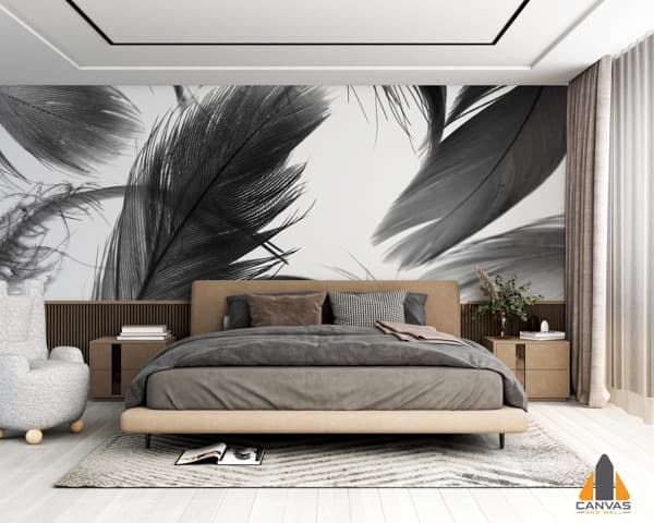 Bedroom with a feature wall displaying a black and white feather wall mural behind the bed.