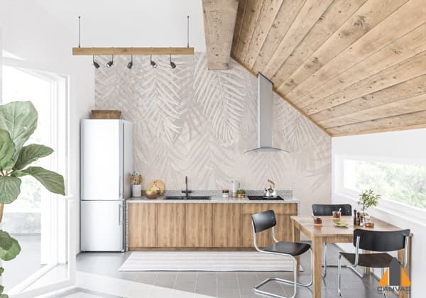 Light kitchen with tropical leaf custom wallpaper and a wooden dining table, ideal for wallpaper installations in Gauteng.