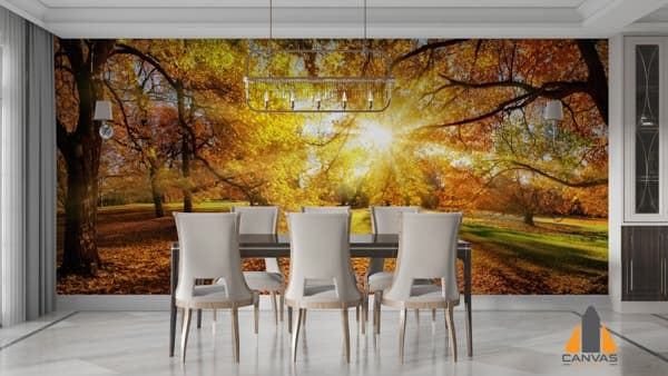 Autumn forest wall mural with sun rays filtering through trees in a modern dining room setting.