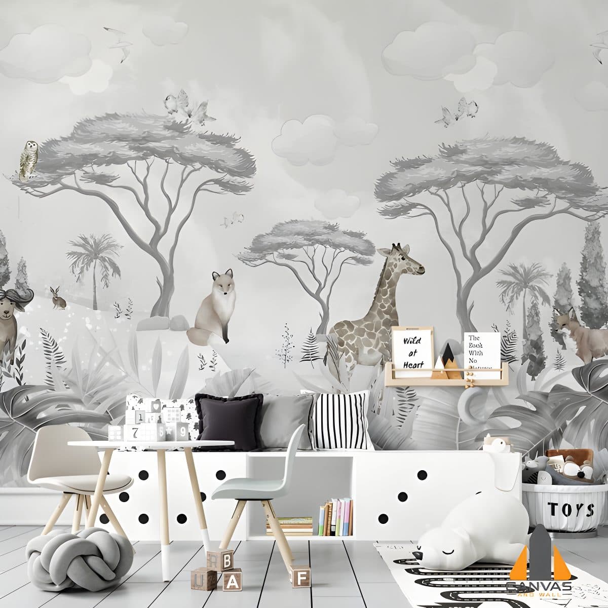 Monochromatic safari wall mural in a child's nursery, featuring animals and trees.
