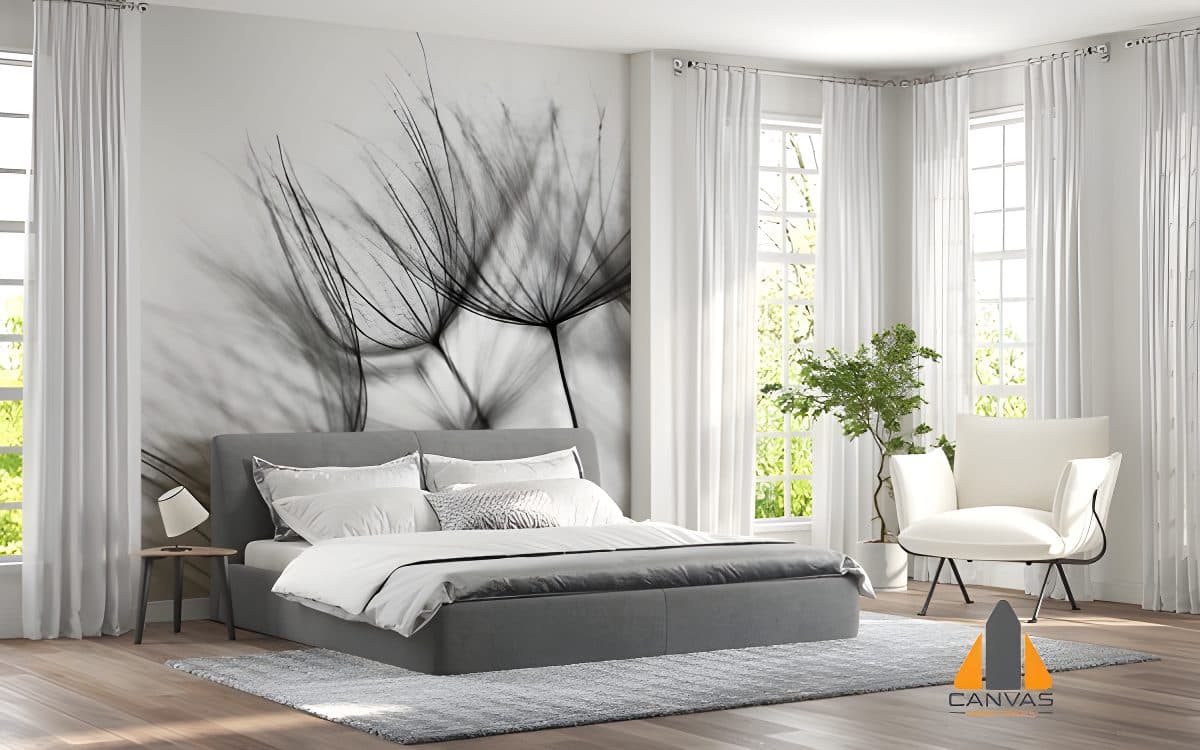 Bedroom with a large dandelion seed head wall mural above the bed, bathed in natural light.