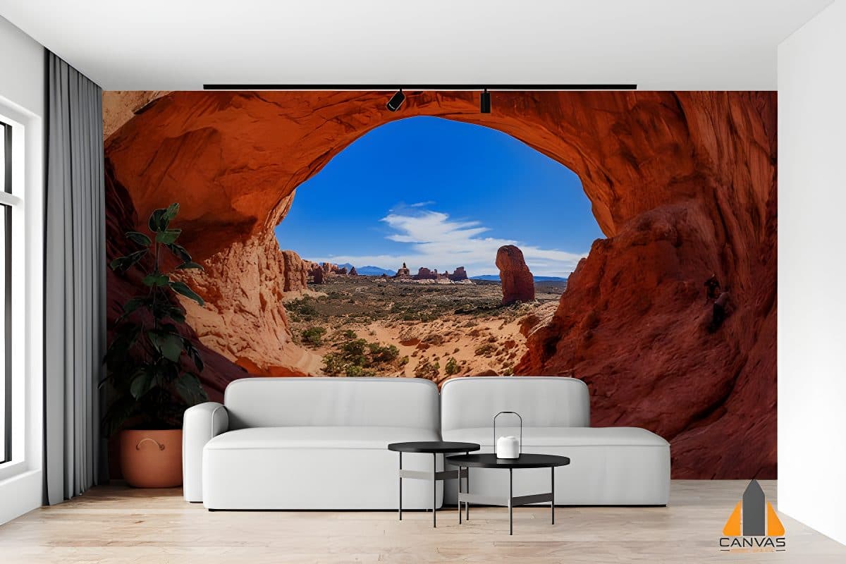 Rock cave desert area wall mural in a modern living room, perfect for wallpaper installations in Gauteng.