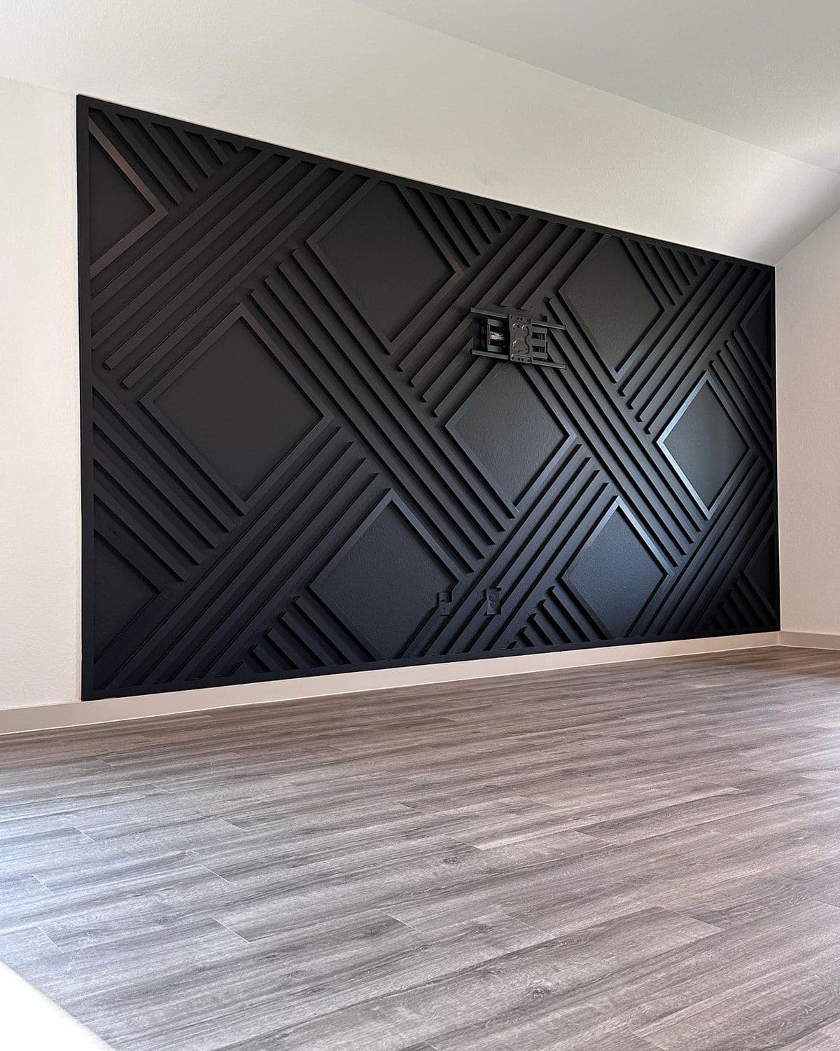 Geometric black accent wall in a modern room, ideal for custom wallpaper installations in Gauteng.