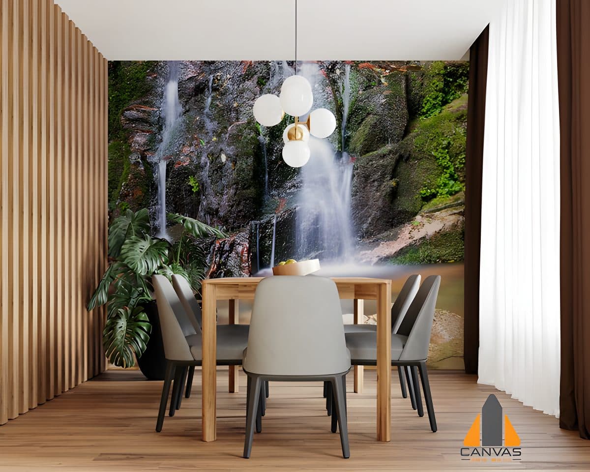 Waterfall wall mural in a modern dining room setting with a wooden table and grey chairs.