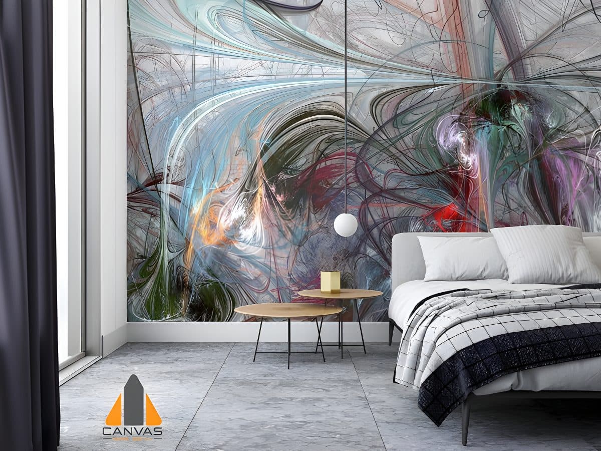 Vibrant abstract wall mural in a modern bedroom with a grey bed and minimalist furniture. Consider wallpaper installations in