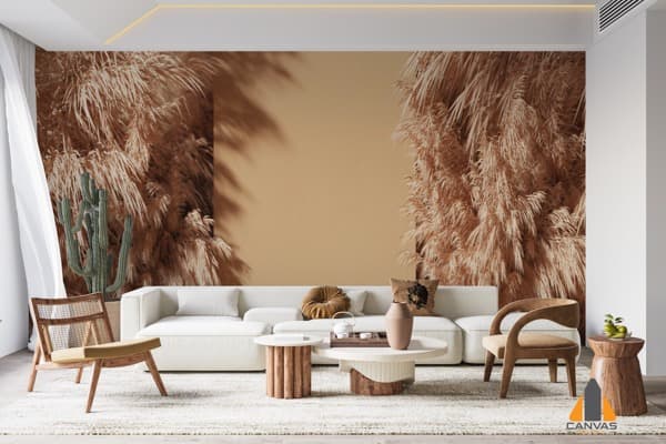 Pampas grass wallpaper mural in a modern living room with a white sofa and wooden furniture.