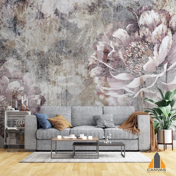 Floral abstract wall mural in a modern living room with a grey couch and coffee table.