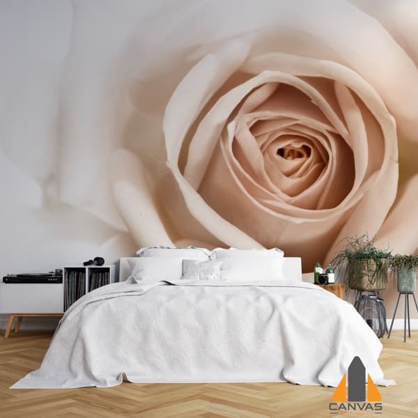 Close-up of a sepia rose wall mural in a modern bedroom, with white bedding and wooden floors.