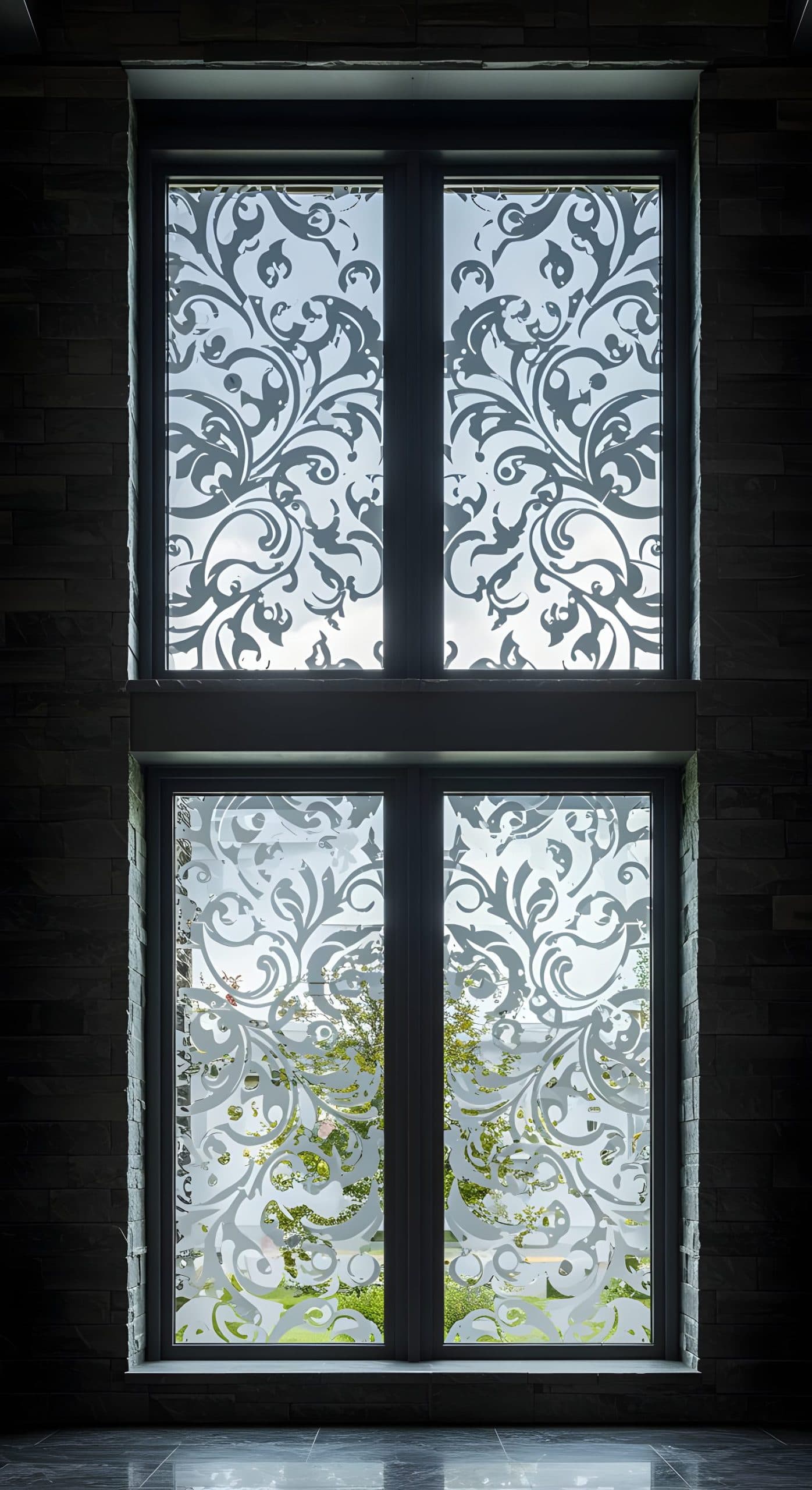 Elegant floral window film frosting a tall window, perfect for privacy or as custom wallpaper.