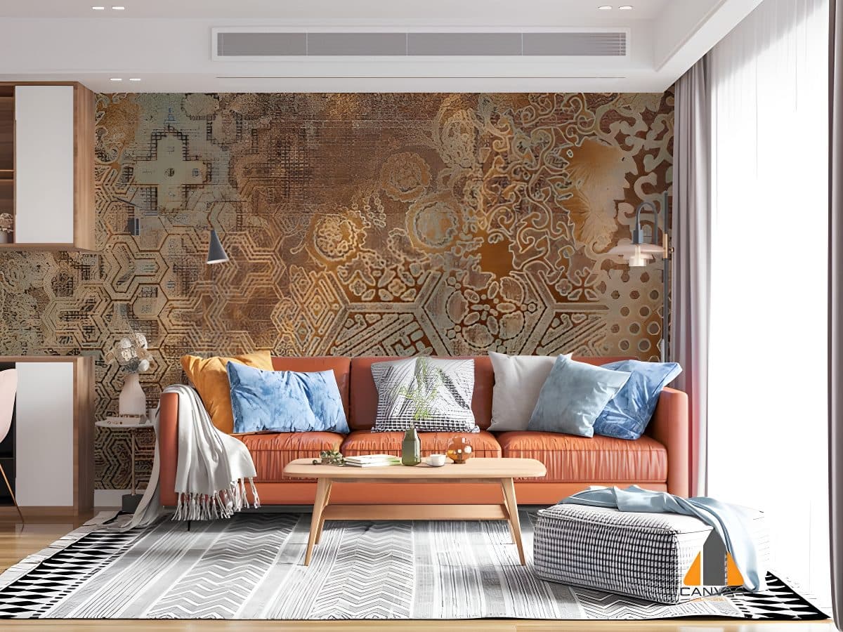 Distressed geometric wallpaper visible in a modern living room with an orange sofa.