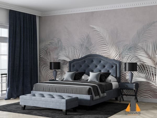 White Palm Leaves wall mural in a bedroom with a blue bed and dark curtains.
