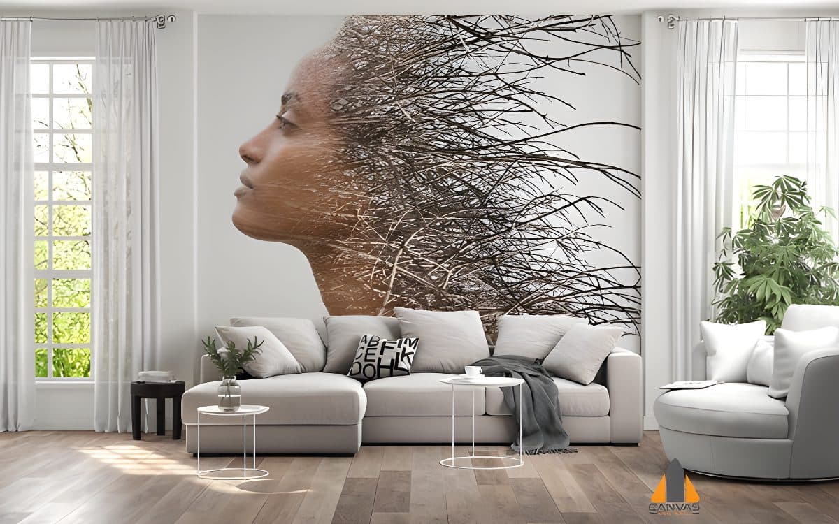 Double exposure of a woman's profile and tree branches, as a wall mural in a modern living room.