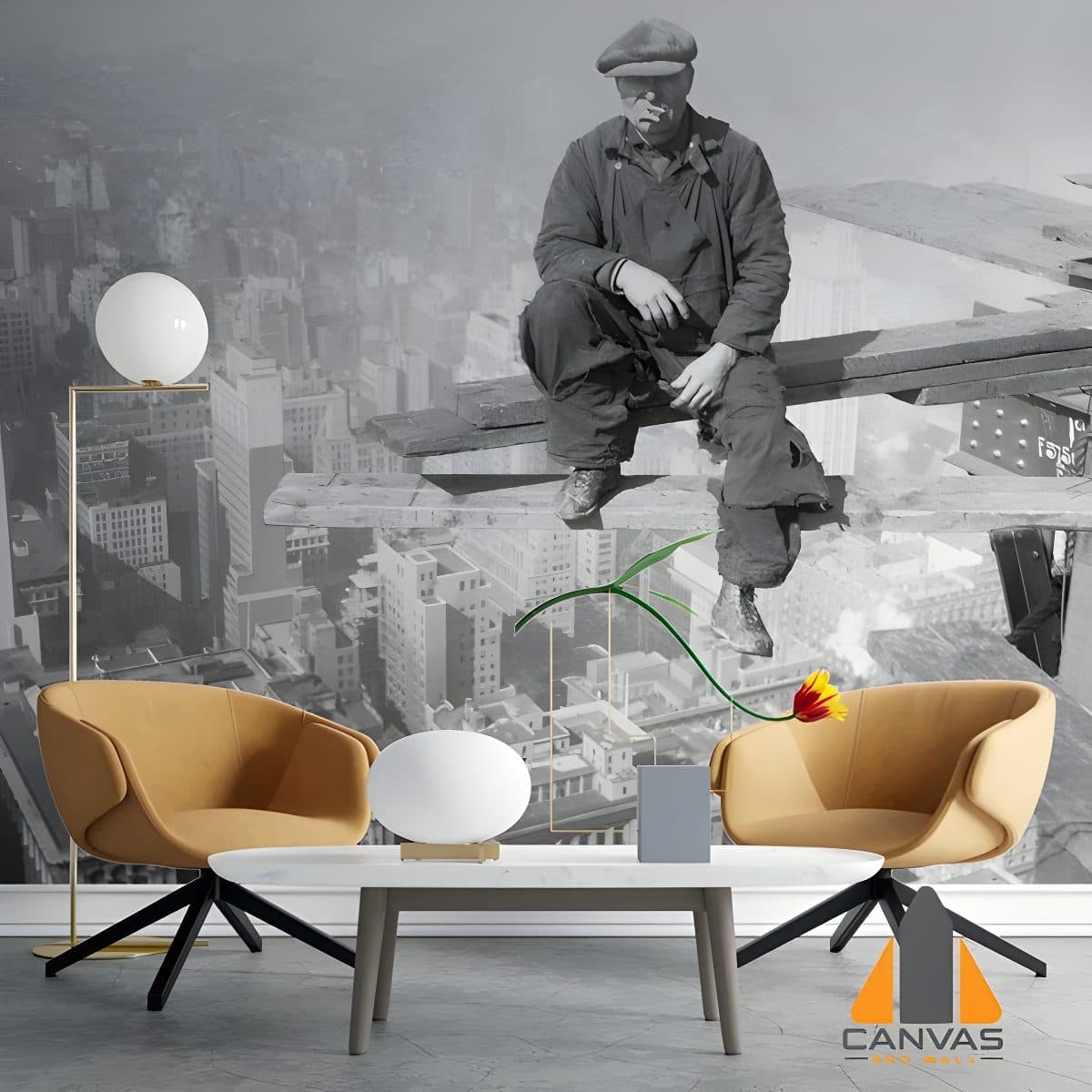 A man sitting on a skyscraper beam overlooks a city, depicted in a stylish wall mural in a modern living room.