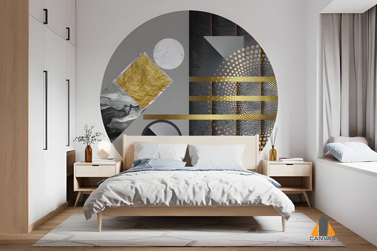 Modern bedroom with a circular geometric wall mural in gray and gold above the bed.