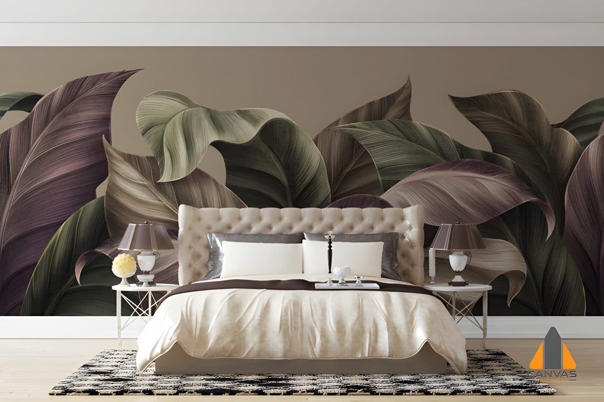 Large tropical leaves wall mural accentuating a stylish bedroom with a tufted headboard furnishing