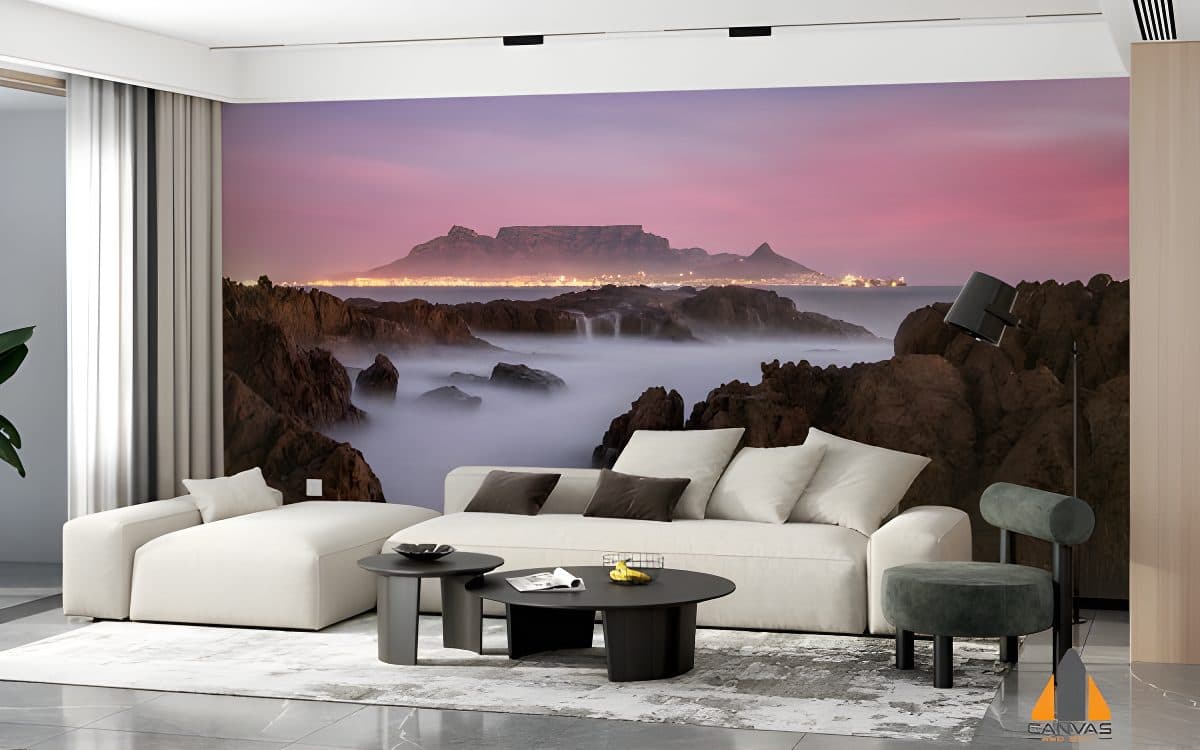 Table Mountain and the illuminated Cape Town skyline at dusk as a wall mural in a modern living room.