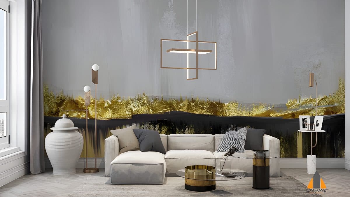 Abstract gold and grey wall mural in a modern living room featuring a white sofa and elegant pendant light.