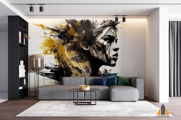 Dramatic portrait wall mural with gold and black paint splashes in a modern living room setting.