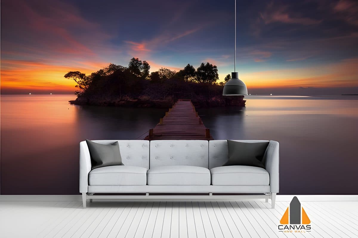 Vivid sunset over a small island and pier wall mural in a modern living room setting.