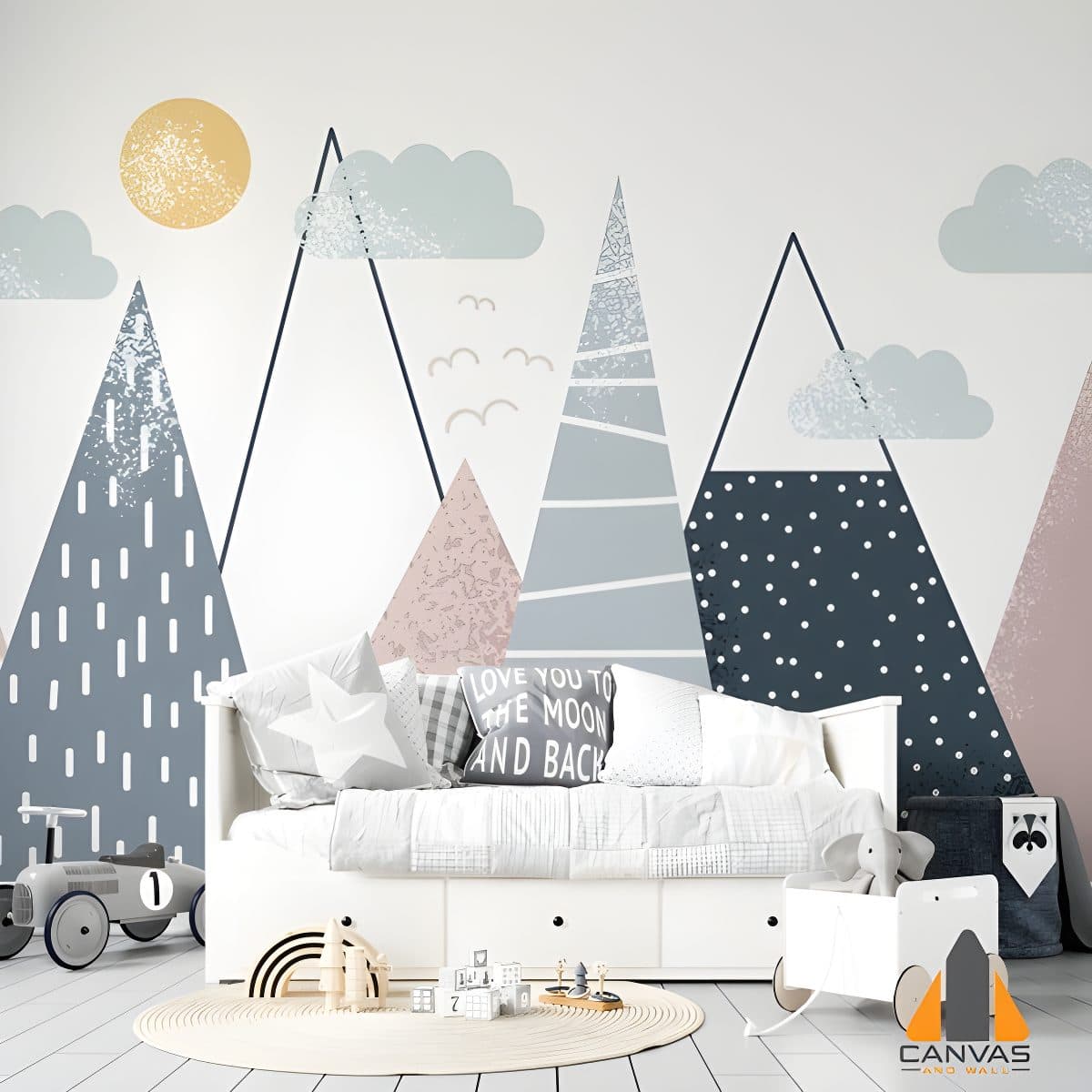 Mountain range wall mural in a child's bedroom with a white daybed