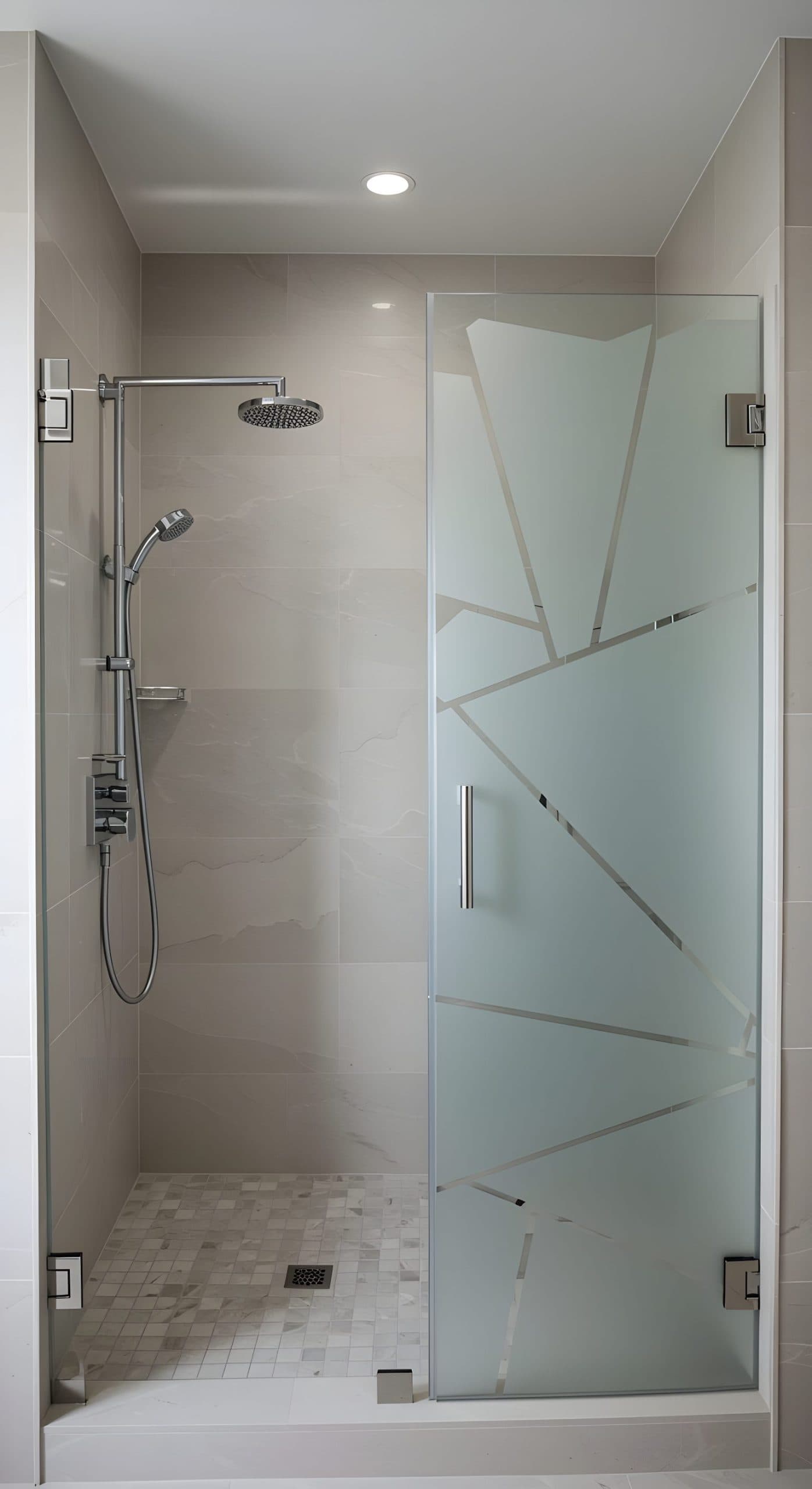 Frosted shower door with geometric pattern in a modern bathroom, perfect for custom wallpaper installations.