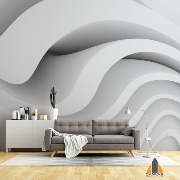 Modern living room with a 3D wavy grey wall mural, sofa, and white cabinet.