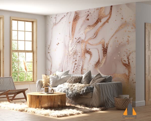 Pink and rose gold marble wall mural in a modern living room with large windows.