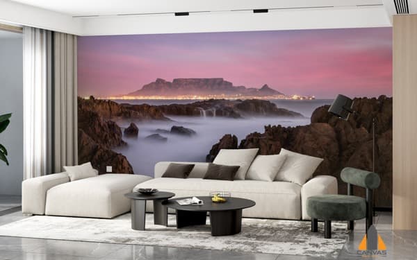 Table Mountain and the illuminated Cape Town skyline at dusk as a wall mural in a modern living room.
