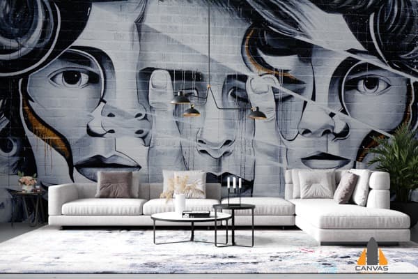 Multiple faces created with sliced patterns on a wall mural in a modern living room. Get wallpaper installations in Gauteng.