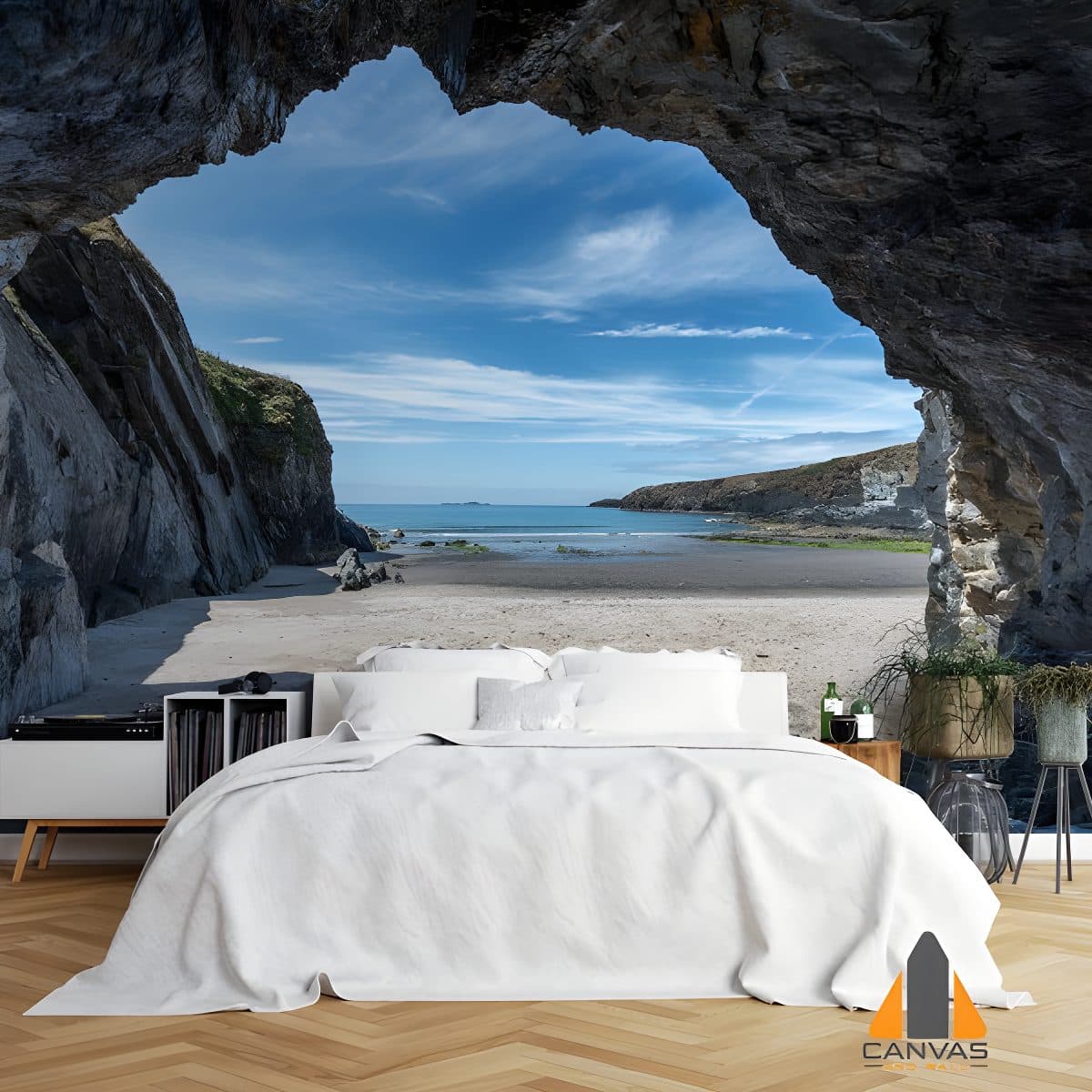 Cave opening to a beach scene wall mural in a modern bedroom, perfect for wallpaper installations Johannesburg.