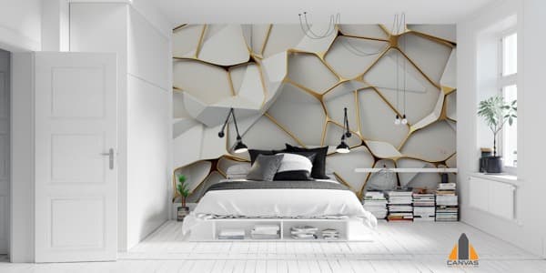 White and gold honeycomb wallpaper in a modern bedroom with a bed and minimalist decor.