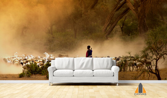 shepherd leading a flock of goats